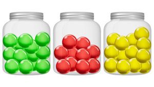 Three jars with colored marbles