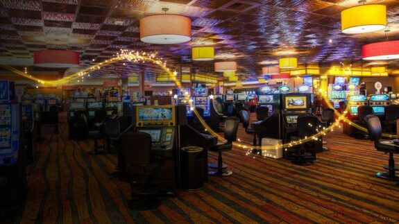 Slot machines at Gold Dust West are shown with a graphic of a gold sparkle swirl.