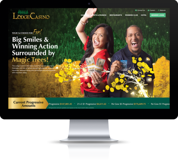 Two gamblers holding money and a plastic card smile on the new website for The Lodge Casino.