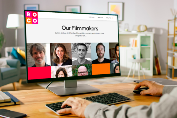A person views filmmakers the new website for ROCO Films while sitting at a computer in a living room.